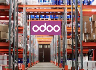 The Future of Manufacturing: How Odoo Is Leading the Way Workers using Odoo’s Manufacturing Module on a tablet to manage production and inventory in a modern factory setting