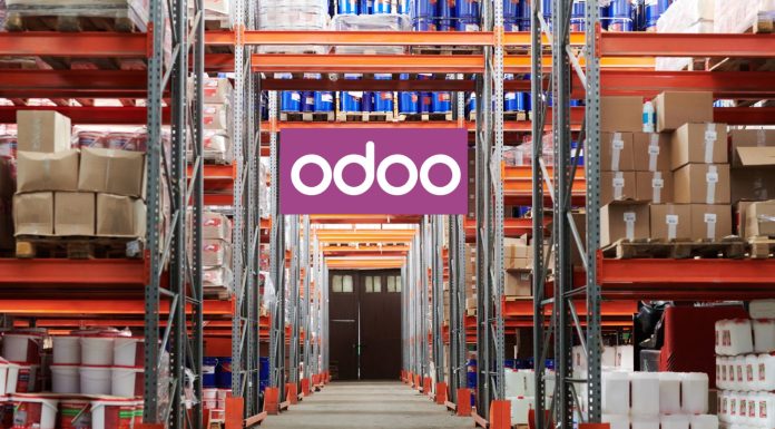 The Future of Manufacturing: How Odoo Is Leading the Way Workers using Odoo’s Manufacturing Module on a tablet to manage production and inventory in a modern factory setting