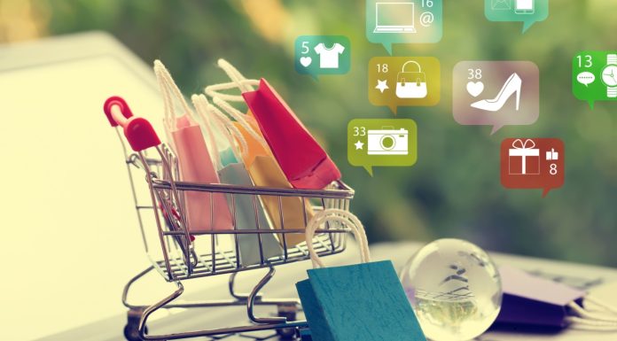 How Odoo Makes Retail and Online Shopping Easier for Businesses Retail shop owner managing both online and in-store orders using Odoo’s all-in-one business dashboard on a tablet.