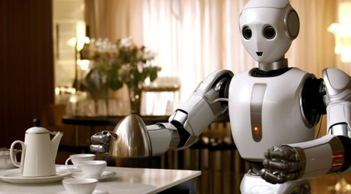 Tesla’s Robot Can Now Do Household Chores — Elon Musk Calls It the “Biggest Product Ever” “Tesla’s Optimus humanoid robot folding clothes in a home setting during a demonstration of real-life chores.”