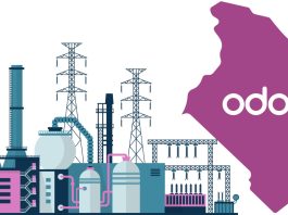 Factory worker using Odoo Manufacturing Module on a tablet to track production and inventory in a Kenyan manufacturing plant