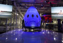 What’s Going On with SpaceX’s Dragon Spacecraft and Elon Musk’s New Plans? “SpaceX Dragon spacecraft floating in orbit above Earth with stars and space in the background.”
