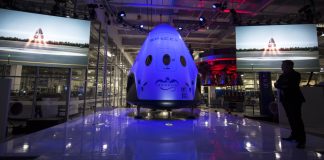 What’s Going On with SpaceX’s Dragon Spacecraft and Elon Musk’s New Plans? “SpaceX Dragon spacecraft floating in orbit above Earth with stars and space in the background.”