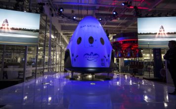 What’s Going On with SpaceX’s Dragon Spacecraft and Elon Musk’s New Plans? “SpaceX Dragon spacecraft floating in orbit above Earth with stars and space in the background.”