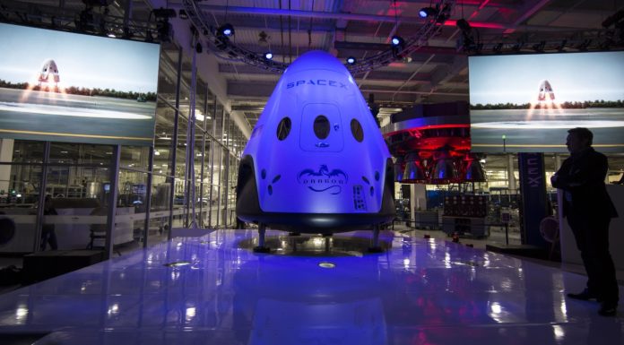 What’s Going On with SpaceX’s Dragon Spacecraft and Elon Musk’s New Plans? “SpaceX Dragon spacecraft floating in orbit above Earth with stars and space in the background.”