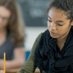 Why Big Tech Companies in China Turned Off AI During a Major Exam “Student taking a test in a classroom while AI tools are disabled on a screen to promote fairness”