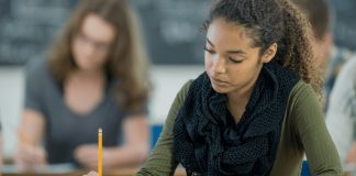 Why Big Tech Companies in China Turned Off AI During a Major Exam “Student taking a test in a classroom while AI tools are disabled on a screen to promote fairness”