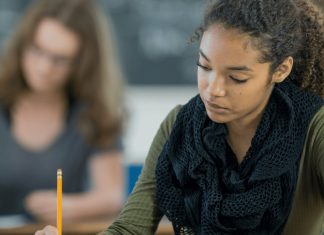 Why Big Tech Companies in China Turned Off AI During a Major Exam “Student taking a test in a classroom while AI tools are disabled on a screen to promote fairness”