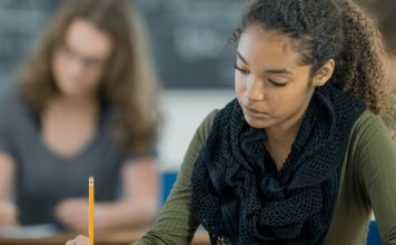 Why Big Tech Companies in China Turned Off AI During a Major Exam “Student taking a test in a classroom while AI tools are disabled on a screen to promote fairness”