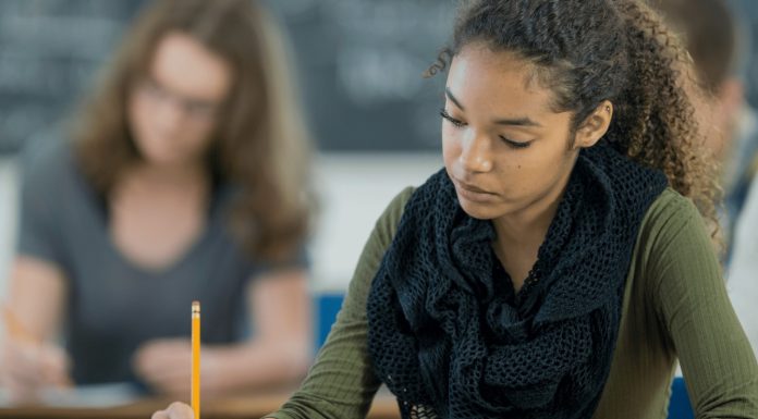 Why Big Tech Companies in China Turned Off AI During a Major Exam “Student taking a test in a classroom while AI tools are disabled on a screen to promote fairness”