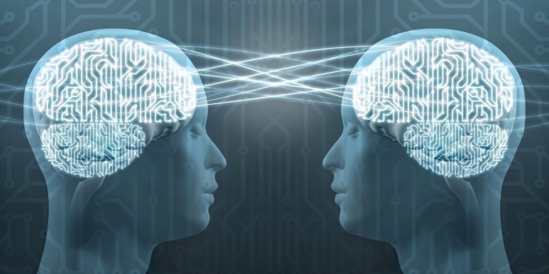 “Illustration of a human head with brainwaves connected to a computer chip. A soft glow shows data being translated from thought to text, symbolizing how AI decodes brain signals.”