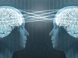 “Illustration of a human head with brainwaves connected to a computer chip. A soft glow shows data being translated from thought to text, symbolizing how AI decodes brain signals.”