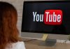 YouTube in Hot Water: Why Australia’s Watchdog is Asking Tough Questions “A concerned Australian parent looking at a teen watching YouTube on a phone, with warning signs and safety icons in the background.”