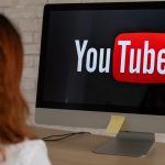 YouTube in Hot Water: Why Australia’s Watchdog is Asking Tough Questions “A concerned Australian parent looking at a teen watching YouTube on a phone, with warning signs and safety icons in the background.”