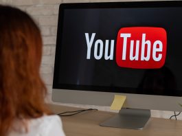 “A concerned Australian parent looking at a teen watching YouTube on a phone, with warning signs and safety icons in the background.”
