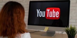 YouTube in Hot Water: Why Australia’s Watchdog is Asking Tough Questions “A concerned Australian parent looking at a teen watching YouTube on a phone, with warning signs and safety icons in the background.”