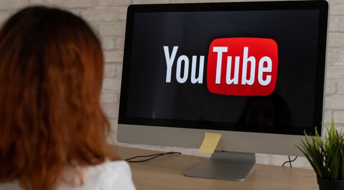 YouTube in Hot Water: Why Australia’s Watchdog is Asking Tough Questions “A concerned Australian parent looking at a teen watching YouTube on a phone, with warning signs and safety icons in the background.”