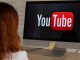 YouTube in Hot Water: Why Australia’s Watchdog is Asking Tough Questions “A concerned Australian parent looking at a teen watching YouTube on a phone, with warning signs and safety icons in the background.”