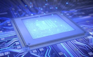 Bridging Two Worlds: How a Tiny Chip Connects Microwaves and Light A tiny silicon chip sitting on a fingertip, symbolizing the future of quantum communication by linking microwaves and light.