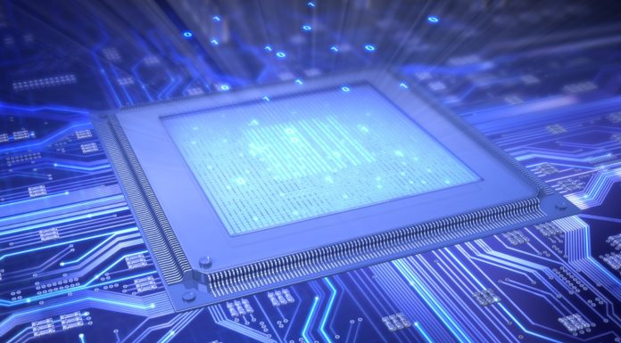 Bridging Two Worlds: How a Tiny Chip Connects Microwaves and Light A tiny silicon chip sitting on a fingertip, symbolizing the future of quantum communication by linking microwaves and light.