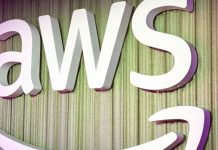 AWS and Anthropic Are Launching an AI Agent Marketplace—Here’s What That Means for Everyone A simple, clean digital illustration of a virtual robot assistant helping a businessperson at a laptop, symbolizing AWS AI agent support in daily tasks.