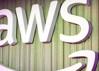 AWS and Anthropic Are Launching an AI Agent Marketplace—Here’s What That Means for Everyone A simple, clean digital illustration of a virtual robot assistant helping a businessperson at a laptop, symbolizing AWS AI agent support in daily tasks.