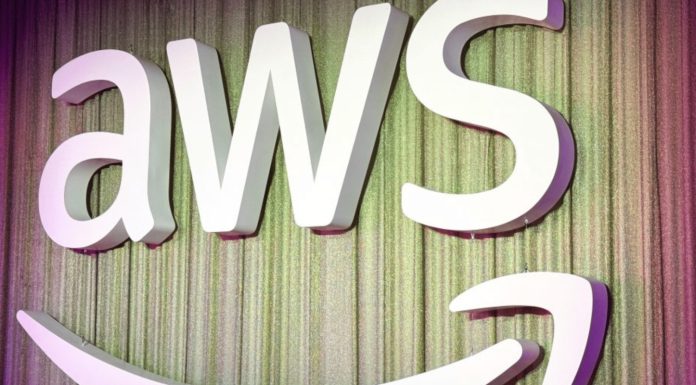 AWS and Anthropic Are Launching an AI Agent Marketplace—Here’s What That Means for Everyone A simple, clean digital illustration of a virtual robot assistant helping a businessperson at a laptop, symbolizing AWS AI agent support in daily tasks.