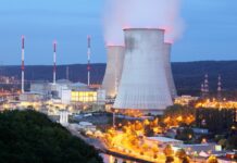 Nuclear-Powered AI? Big Tech Wants It Here’s the Full Story "A glowing AI brain connected to a nuclear reactor symbol, representing the future of artificial intelligence powered by atomic energy."