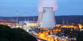 Nuclear-Powered AI? Big Tech Wants It Here’s the Full Story "A glowing AI brain connected to a nuclear reactor symbol, representing the future of artificial intelligence powered by atomic energy."