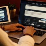 CBA Reverses AI Job Cuts: How a Bank Balances People and Robots “Handshake between human and robot hand over bank counter symbolizing teamwork.”