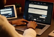 CBA Reverses AI Job Cuts: How a Bank Balances People and Robots “Handshake between human and robot hand over bank counter symbolizing teamwork.”